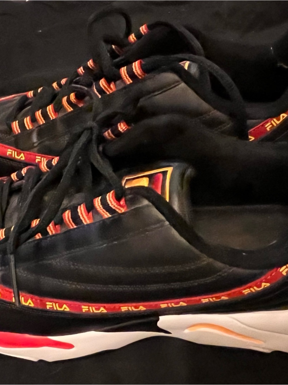 FILA Black Sneakers with Red and Orange Accents